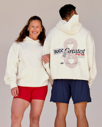 Duo wearing Greatest of All Time Heavyweight Oversized Hoodie - Off White | Model:Tia | Size:S | Model:Shane | Size:L | Thumbnail Index: 0