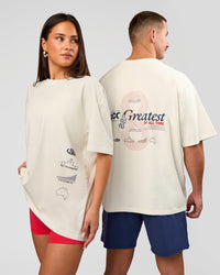 Duo wearing Greatest of All Time Heavyweight FLXCotton Oversized Tee - Off White Washed-Scarlet | Model:Bianca | Size:XS | Model:Jaiden | Size:L | Thumbnail Index: 1