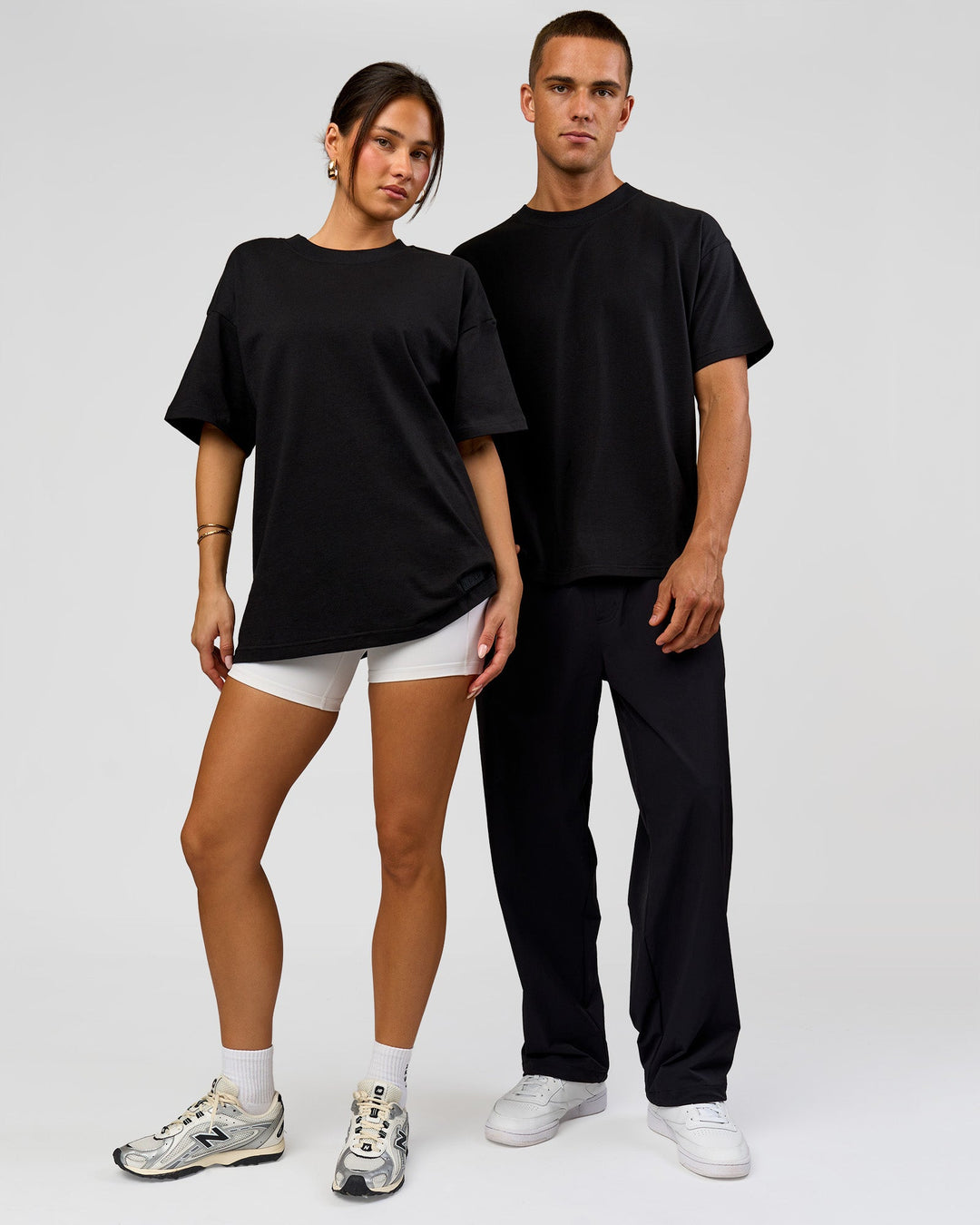 Duo wearing Tonal Legacy Heavyweight Oversized Tee - Black-Black | Model:Bianca | Size:XS | Model:Albert | Size:M - view 4