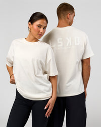 Duo wearing Tonal Legacy Heavyweight Oversized Tee - Off White-Off White | Model:Bianca | Size:XS | Model:Albert | Size:M | Thumbnail Index: 0