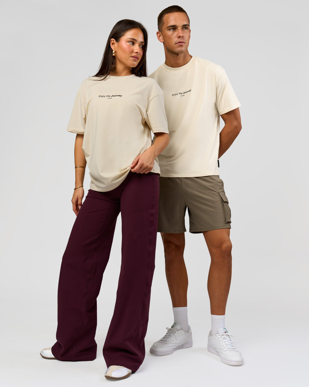 Duo wearing VS1 Enjoy The Journey FLXCotton Oversize Tee - Vanilla Bean | Model:Bianca | Size:XS | Model:Albert | Size:M - view 1