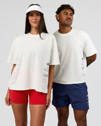 Duo wearing Greatest of All Time Heavyweight FLXCotton Boxed Tee - Off White Washed | Model:Rhiley| Size:XS | Model:Xav | Size:L | Thumbnail Index: 1