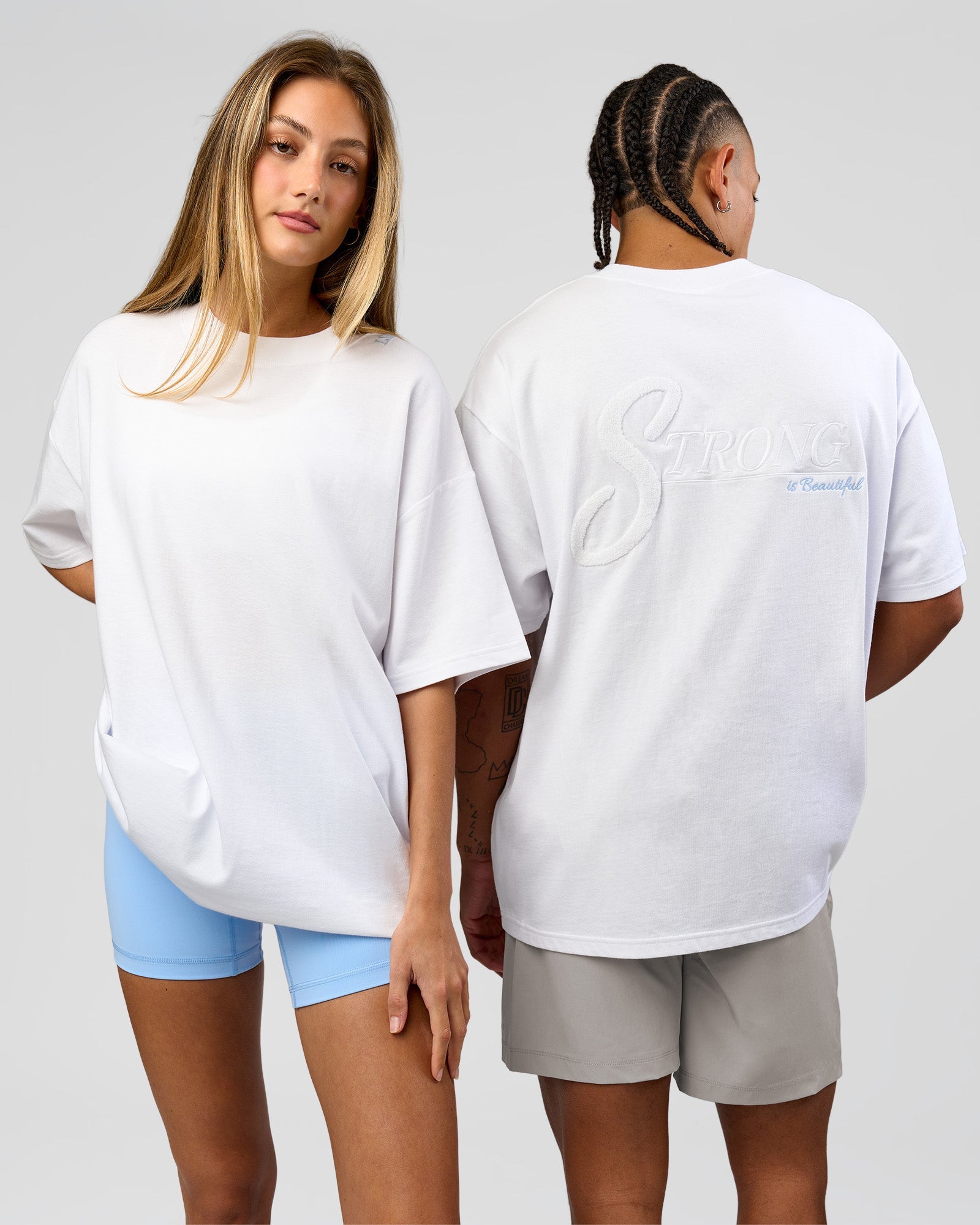 Duo wearing Strong is Beautiful Heavyweight Oversized Tee - White | Model:Georgia | Size:XS | Model:Malebo | Size:M
