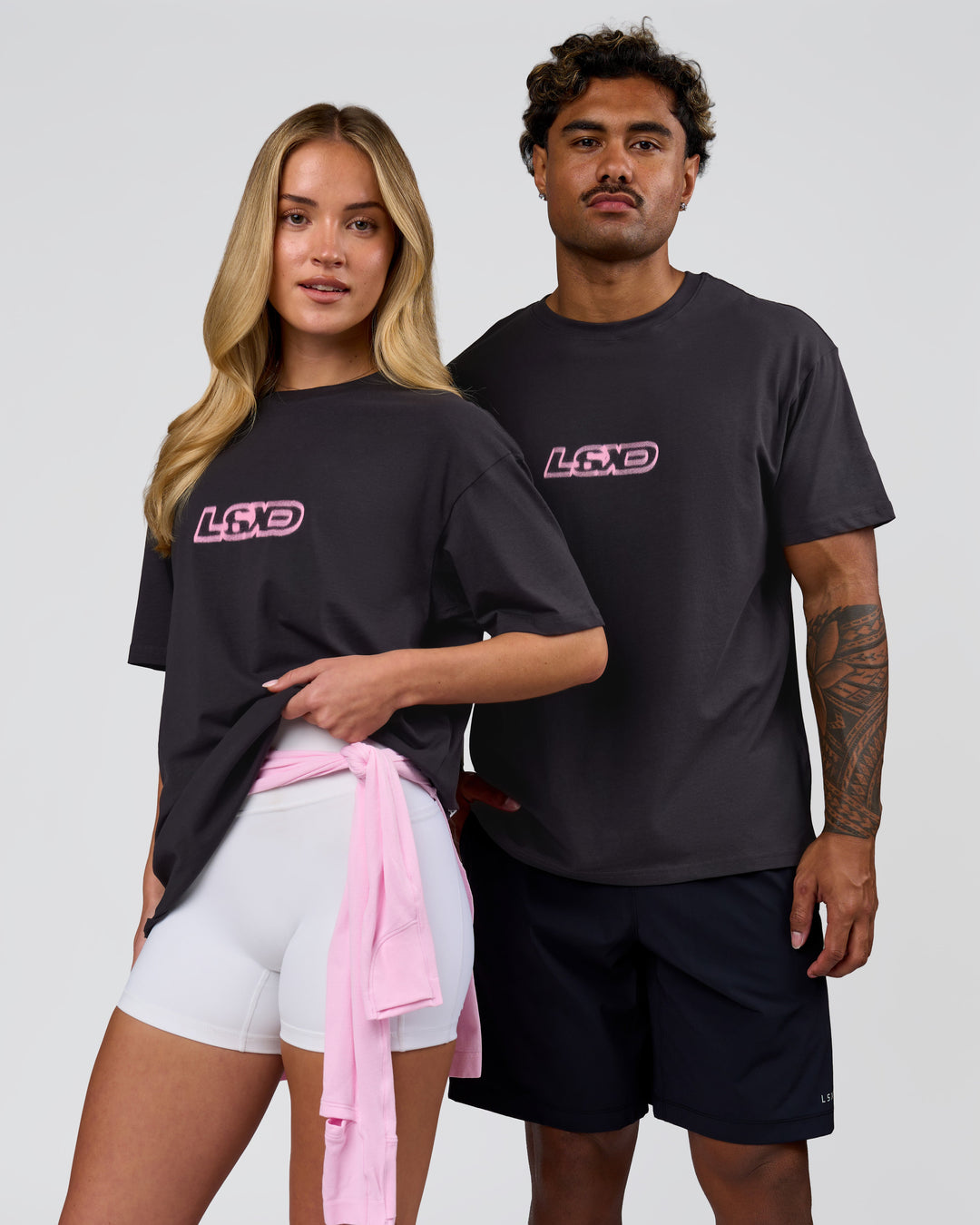 Duo wearing SoCal 26 FLXCotton Oversize Tee  - Onyx-Pink Rose | Model:Issy | Size:XS | Model:Xav | Size:L - view 13