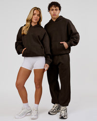 Duo wearing Base Oversized Hoodie - Ground Coffee | Model:Issy | Size:XS | Model:Leandro | Size:M | Thumbnail Index: 1