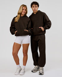 Duo wearing Base Oversized Hoodie - Ground Coffee | Model:Issy | Size:XS | Model:Leandro | Size:M | Thumbnail Index: 4