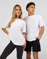 Duo wearing Benchmark FLXCotton Oversized Tee - White-Pale Lilac | Model:Issy | Size:XS | Model:Leandro | Size:M | Thumbnail Index: 3