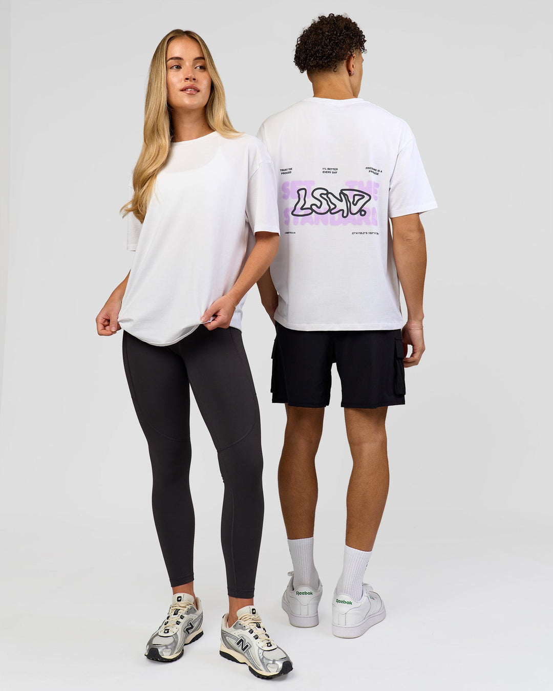 Duo wearing Benchmark FLXCotton Oversized Tee - White-Pale Lilac | Model:Issy | Size:XS | Model:Leandro | Size:M - view 7