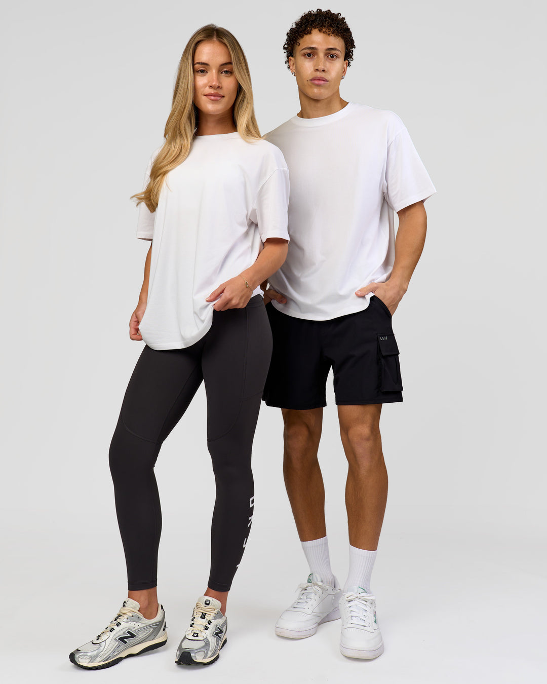 Duo wearing Benchmark FLXCotton Oversized Tee - White-Pale Lilac | Model:Issy | Size:XS | Model:Leandro | Size:M - view 10