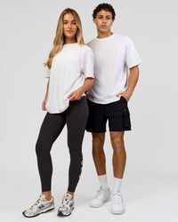 Duo wearing Benchmark FLXCotton Oversized Tee - White-Pale Lilac | Model:Issy | Size:XS | Model:Leandro | Size:M | Thumbnail Index: 9