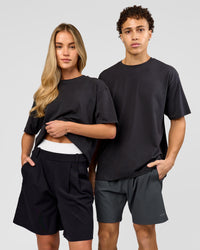 Duo wearing Benchmark FLXCotton Oversized Tee - Onyx-Yellow Fizz | Model:Issy | Size:XS | Model:Leandro | Size:M | Thumbnail Index: 1