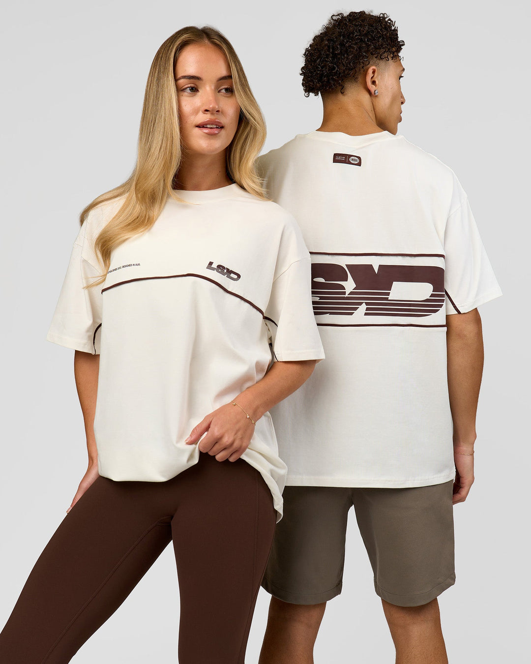 Duo wearing Inline Heavyweight FLXCotton Oversized Tee - Off White-Hot Chocolate | Model:Issy | Size:XS | Model:Leandro | Size:M - view 1