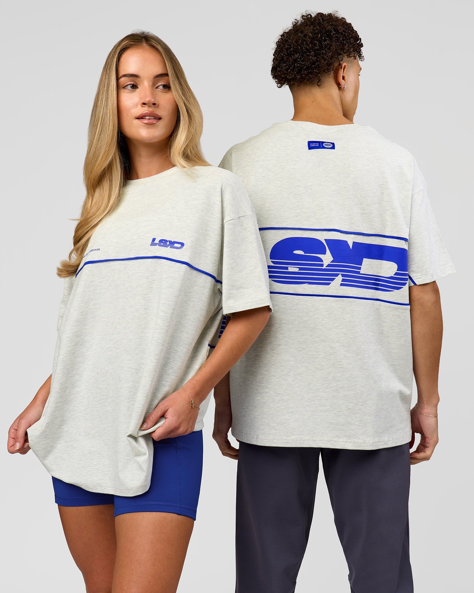 Duo wearing Inline Heavyweight FLXCotton Oversized Tee - Silver Marl-Power Cobalt | Model:Issy | Size:XS | Model:Leandro | Size:M