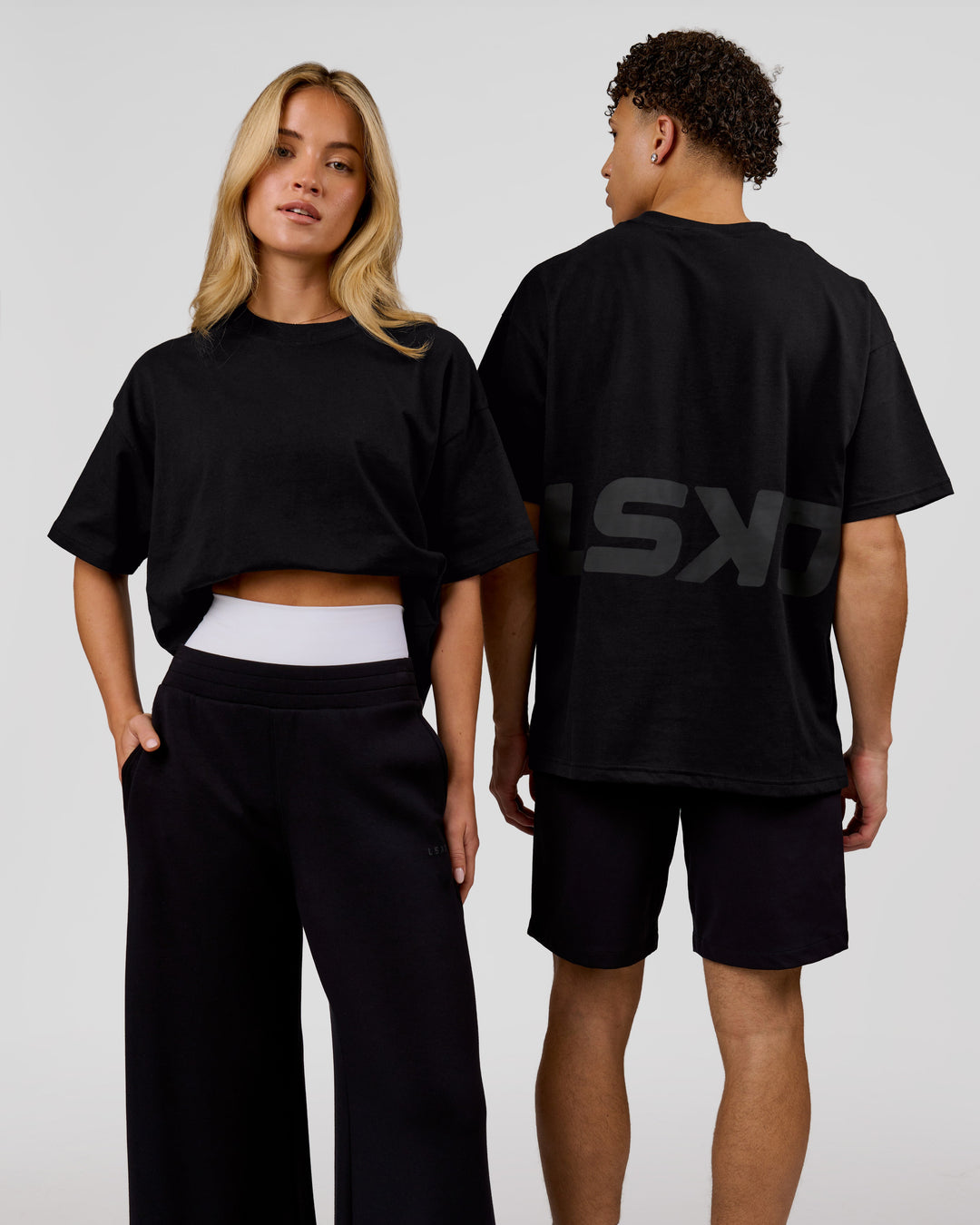 Duo wearing Shadow Mark Heavyweight Oversized Tee - Black-Onyx | Model:Issy | Size:XS | Model:Leandro | Size:M - view 1