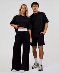 Duo wearing Shadow Mark Heavyweight Oversized Tee - Black-Onyx | Model:Issy | Size:XS | Model:Leandro | Size:M | Thumbnail Index: 6