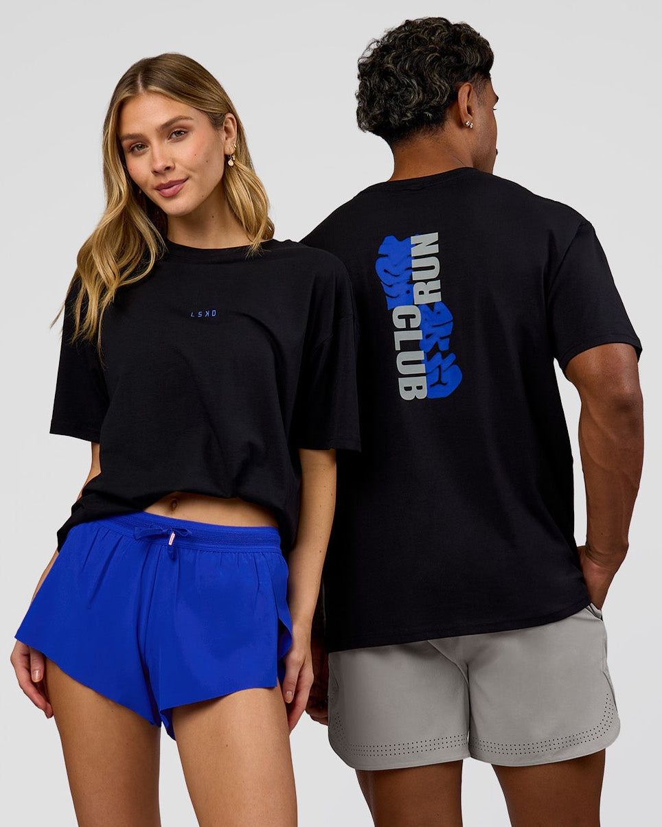Duo wearing Run Club Elevate FLXCotton Oversized Tee - Black-Electric Indigo | Model:Leilani | Size:XS | Model:Xav | Size:L