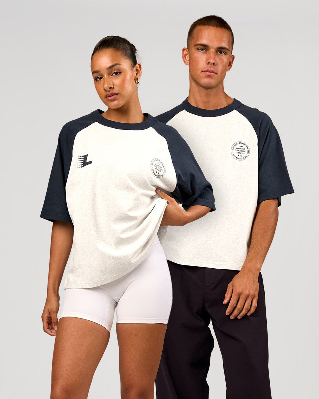 Duo wearing Victory Heavyweight Boxed Raglan Tee - Silver Marl-Midnight Navy | Model:Rosie | Size:XS | Model:Albert | Size:M - view 1