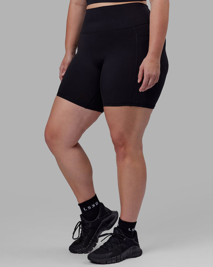 Woman wearing Fusion Mid Short Tight - Black
