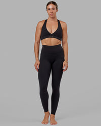 Woman wearing Fusion Ultra High-Rise Tall Legging Pockets - Black | Model:Bree | Size:S