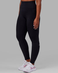 Woman wearing Fusion Ultra High-Rise Tall Legging Pockets - Black | Model:Sierra | Size:L