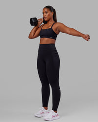 Woman wearing Fusion Ultra High-Rise Tall Legging Pockets - Black | Model:Sierra | Size:L