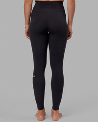 Woman wearing O.G. Fusion Ultra High-Rise Tall Legging Pockets - Black | Model:Bree | Size:S