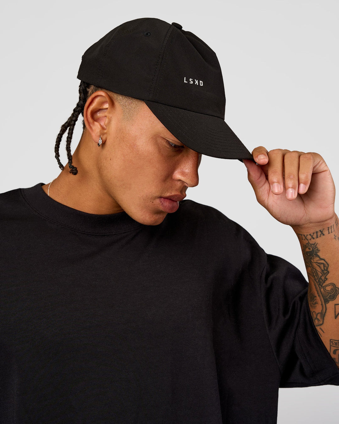 man wearing LSKD TRD CAP - Black-Off White