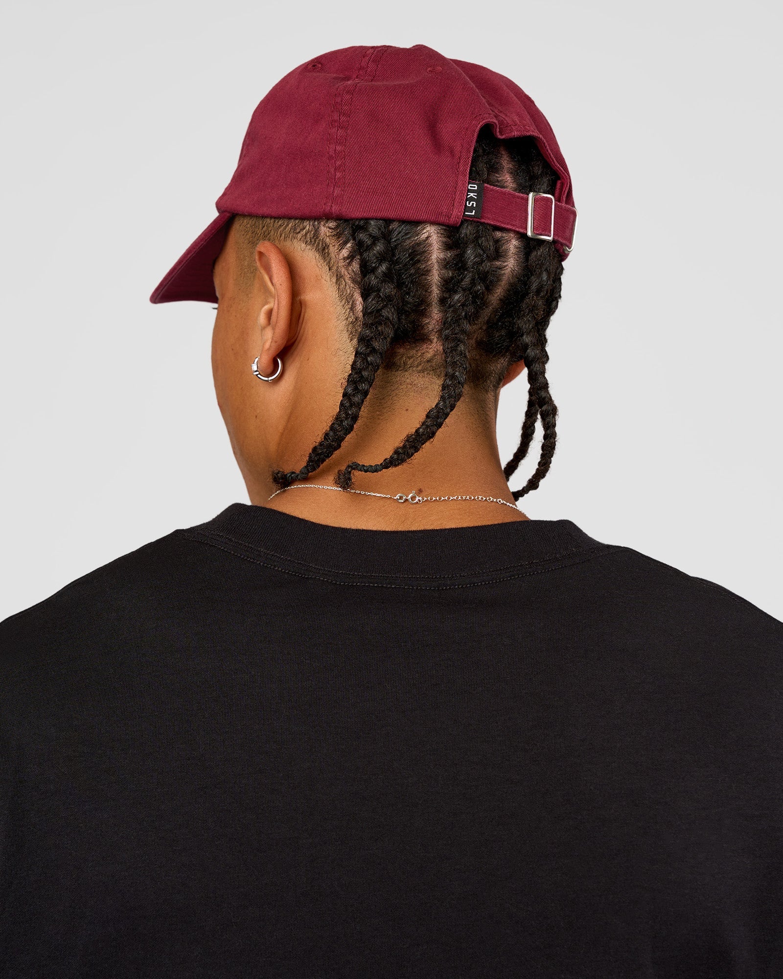 Man wearing All Day Cap - Cherry Lacquer | Model:Day | Size:ALL