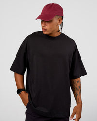 Man wearing All Day Cap - Cherry Lacquer | Model:Day | Size:ALL | Thumbnail Index: 2