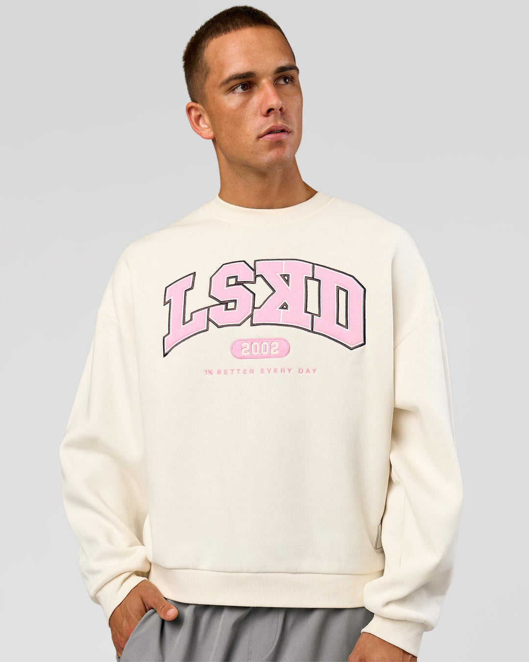 Man wearing Varsity Boxy Crew - Off White-Pink Rose | Model:Albert | Size:L - view 1