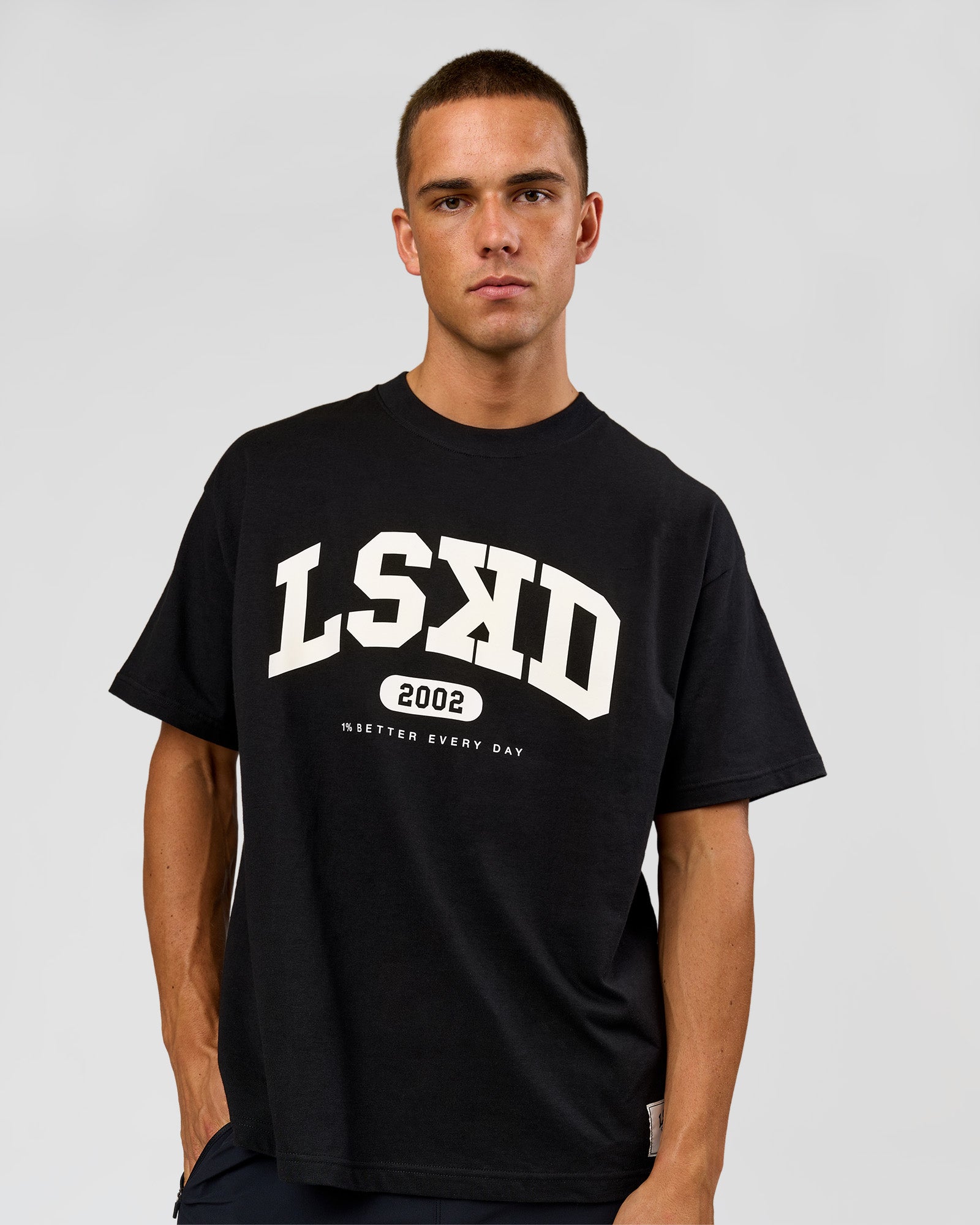 Man wearing Varsity EST Heavyweight Oversized Tee  - Black-Off White | Model:Albert | Size:L