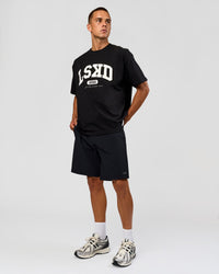 Man wearing Varsity EST Heavyweight Oversized Tee  - Black-Off White | Model:Albert | Size:L | Thumbnail Index: 2
