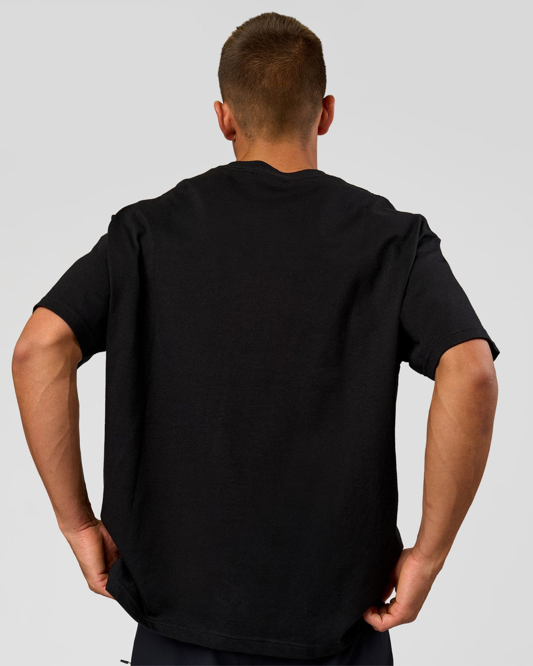 Man wearing Varsity EST Heavyweight Oversized Tee  - Black-Off White | Model:Albert | Size:L - view 6