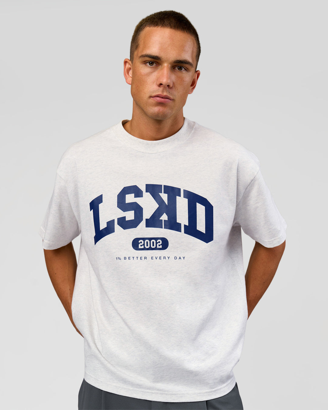 Man wearing Varsity EST Heavyweight Oversized Tee  - Silver Marl-Future Navy | Model:Albert | Size:L - view 10