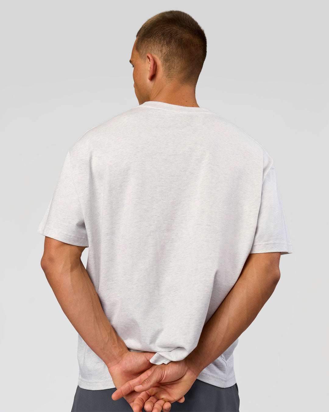 Man wearing Varsity EST Heavyweight Oversized Tee  - Silver Marl-Future Navy | Model:Albert | Size:L - view 12