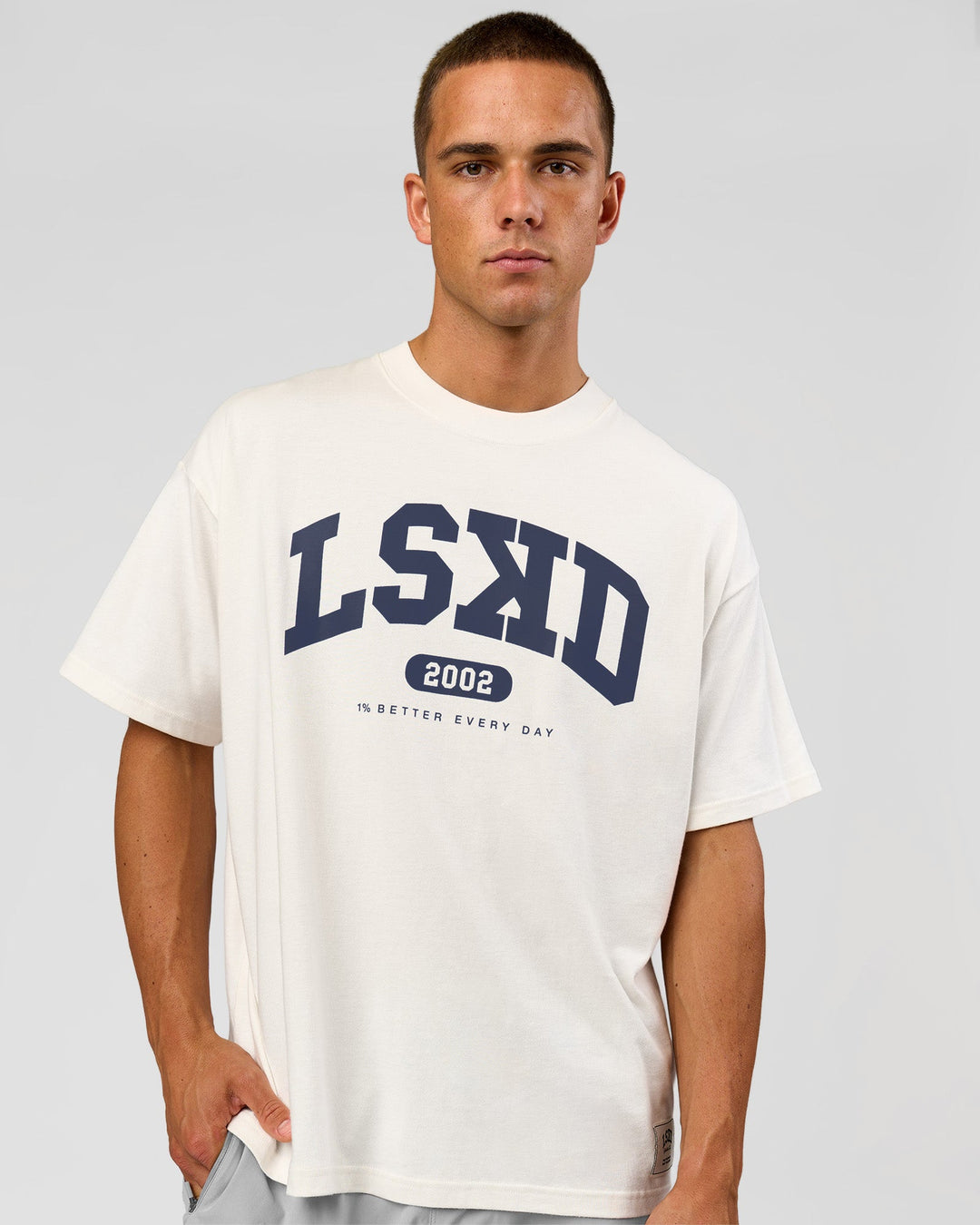 Man wearing Varsity EST Heavyweight Oversized Tee  - Off White-Future Navy | Model:Albert | Size:L - view 1