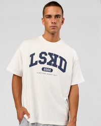 Man wearing Varsity EST Heavyweight Oversized Tee  - Off White-Future Navy | Model:Albert | Size:L | Thumbnail Index: 0