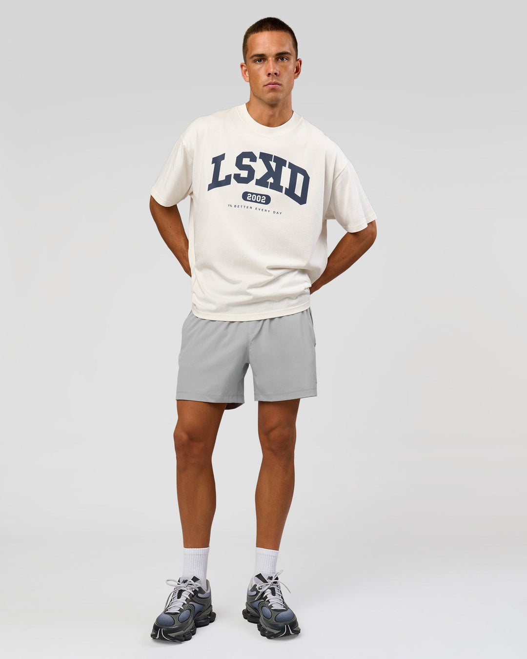 Man wearing Varsity EST Heavyweight Oversized Tee  - Off White-Future Navy | Model:Albert | Size:L - view 2