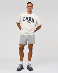 Man wearing Varsity EST Heavyweight Oversized Tee  - Off White-Future Navy | Model:Albert | Size:L | Thumbnail Index: 1