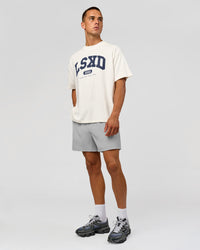 Man wearing Varsity EST Heavyweight Oversized Tee  - Off White-Future Navy | Model:Albert | Size:L | Thumbnail Index: 7