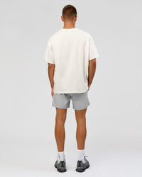 Man wearing Varsity EST Heavyweight Oversized Tee  - Off White-Future Navy | Model:Albert | Size:L | Thumbnail Index: 12