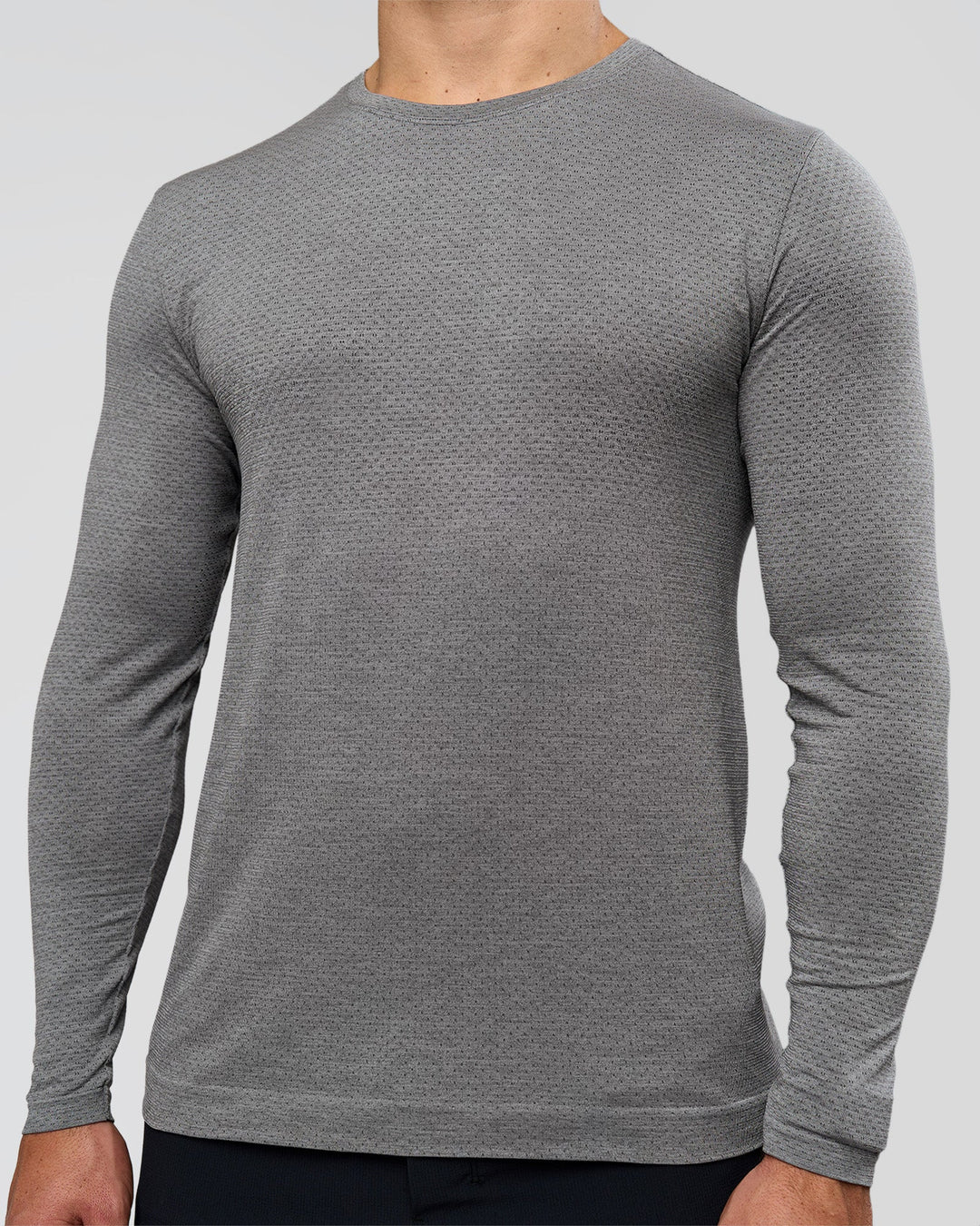 Man wearing AeroFLX+ Seamless Long Sleeve Tee (Set in Sleeve) - Dark Storm/Alloy | Model:Jaiden | Size:L - view 2