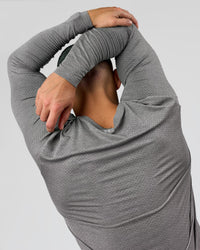Man wearing AeroFLX+ Seamless Long Sleeve Tee (Set in Sleeve) - Dark Storm/Alloy | Model:Jaiden | Size:L | Thumbnail Index: 8