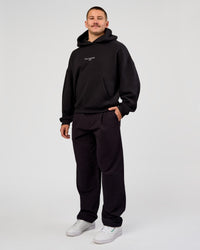 Man wearing Andrew J. Steel x LSKD Boxy Hoodie - Black | Model:Jaiden | Size:L | Thumbnail Index: 8