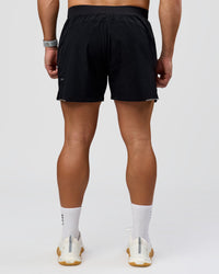 Man wearing Hybrid Lined 5" Short - Black-Reflective | Model:Jaiden | Size:L | Thumbnail Index: 4