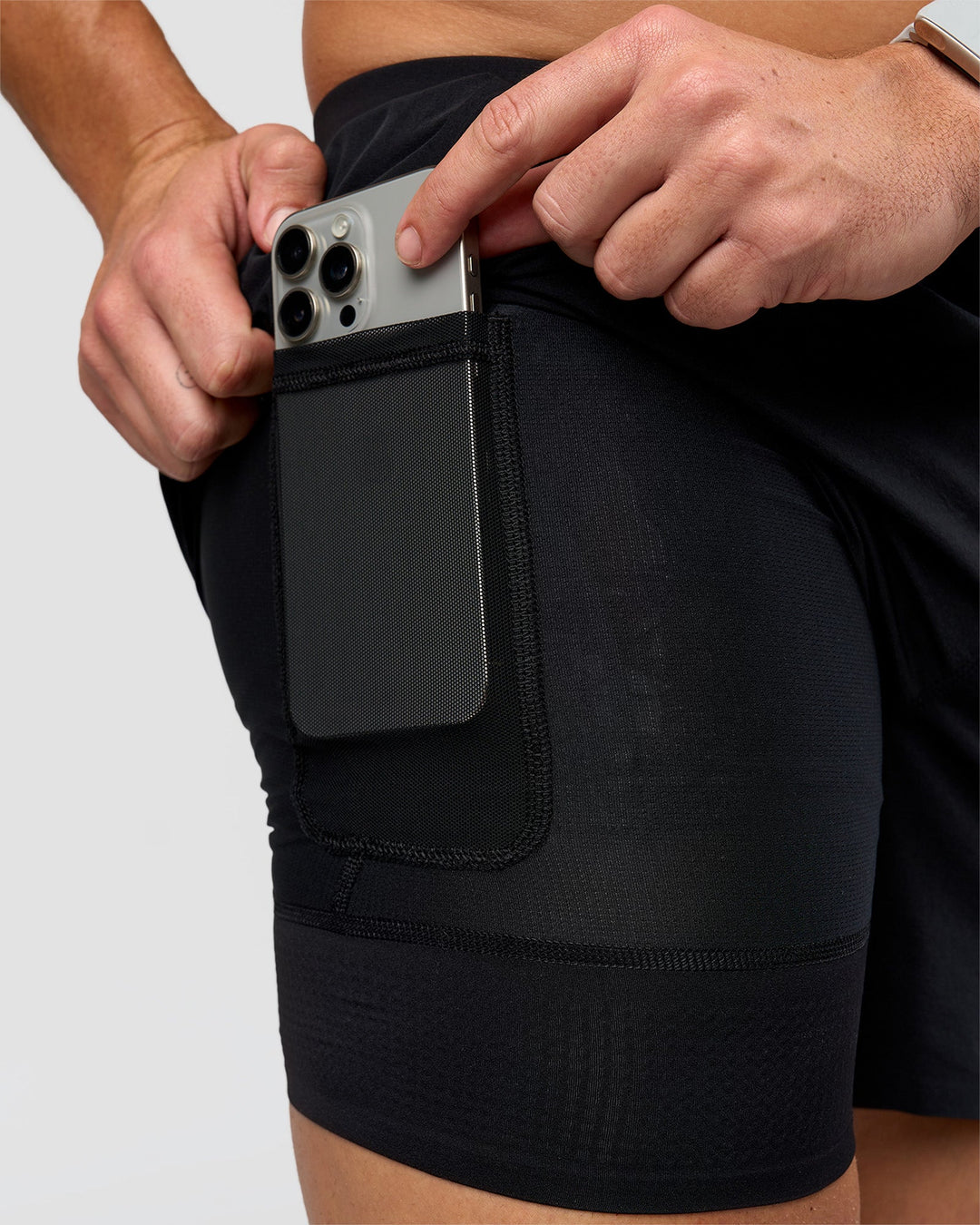 Man wearing Hybrid Lined 5" Short - Black-Reflective | Model:Jaiden | Size:L - view 2