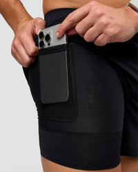 Man wearing Hybrid Lined 5" Short - Black-Reflective | Model:Jaiden | Size:L | Thumbnail Index: 1