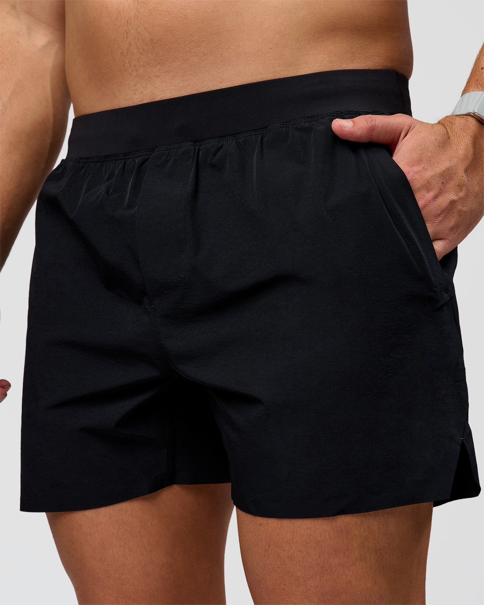 Man wearing Hybrid Lined 5" Short - Black-Reflective | Model:Jaiden | Size:L