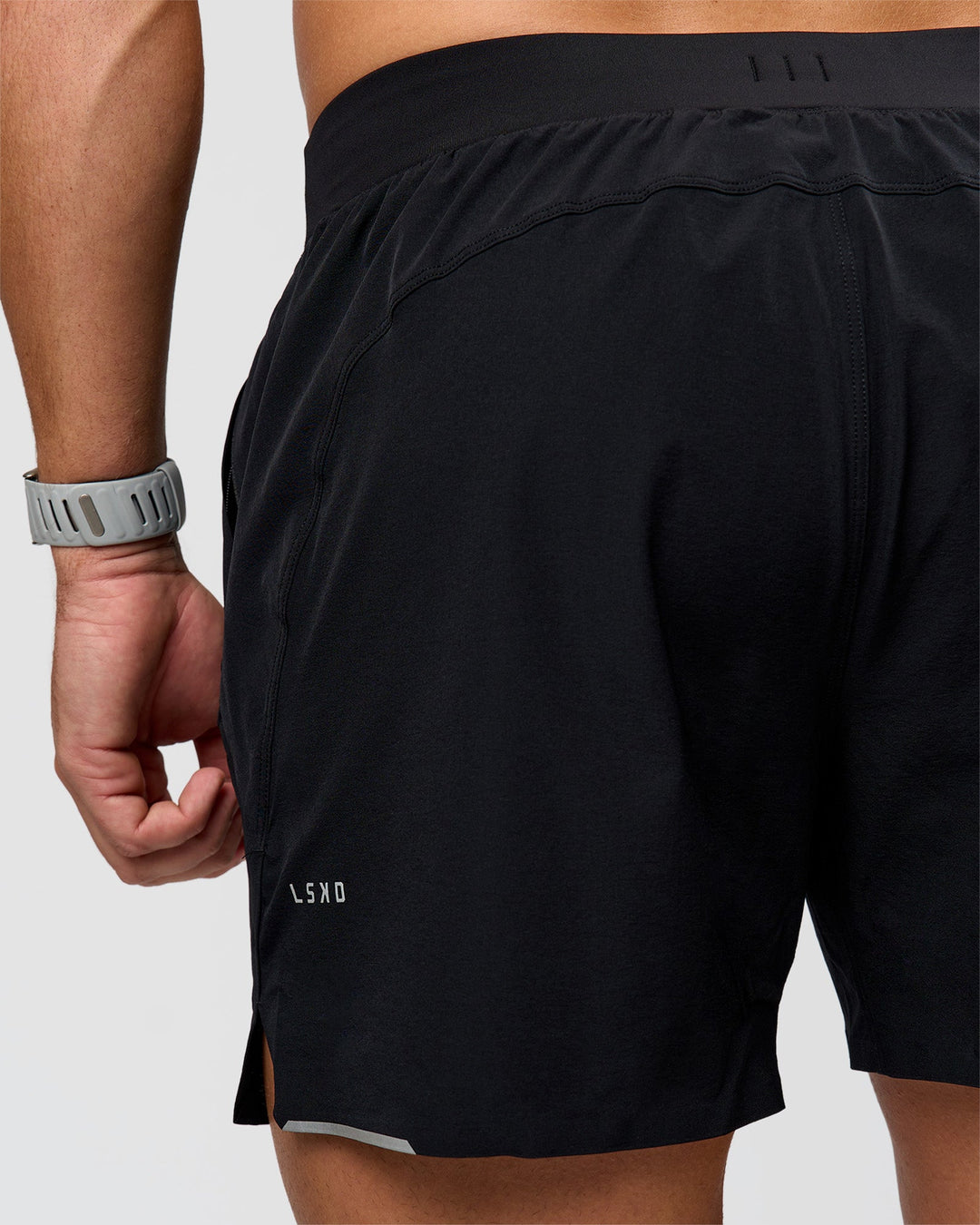 Man wearing Hybrid Lined 5" Short - Black-Reflective | Model:Jaiden | Size:L - view 10