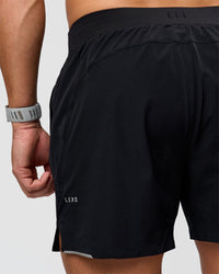 Man wearing Hybrid Lined 5" Short - Black-Reflective | Model:Jaiden | Size:L | Thumbnail Index: 9